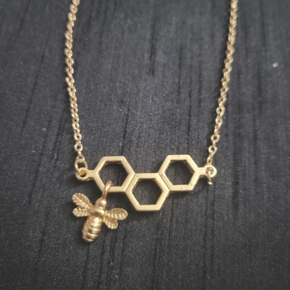 Bumble bee charm attached to honeycomb necklace